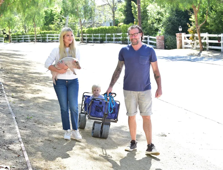 Tori Spelling out for a Walk with her Husband and son and Pet Pig