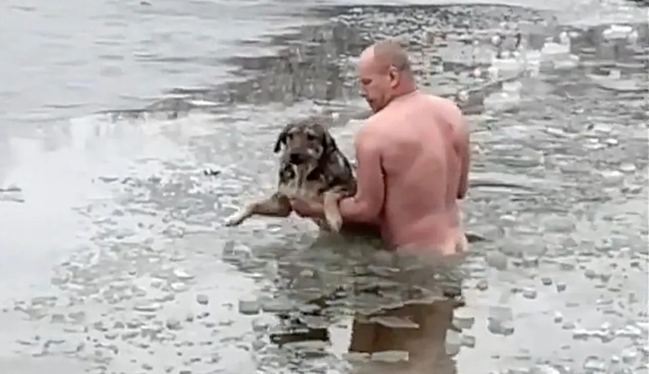 Villager strips to his underwear and crawls over ice to rescue whining marooned mongrel stuck in frozen pond