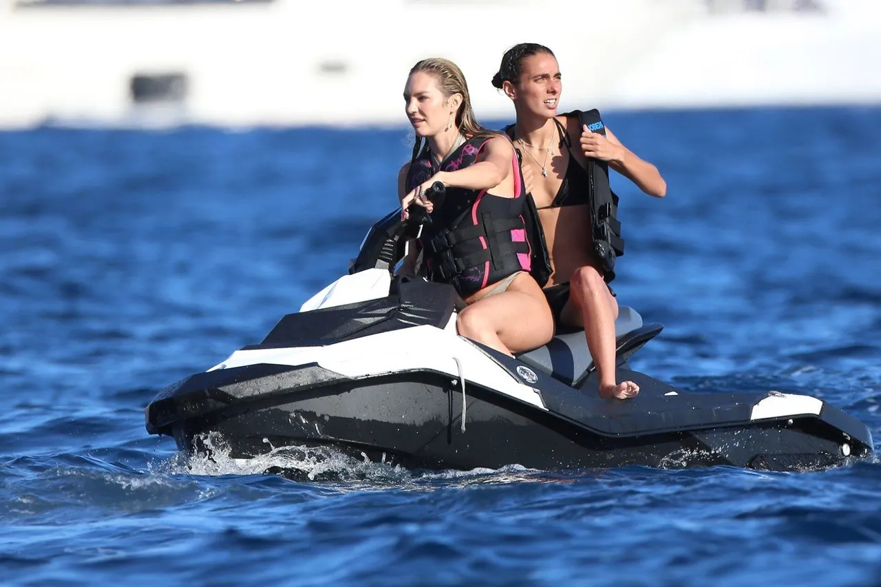 Doutzen Kroes and Candice Swanepoel relax on a yacht with Mo Al Turki during holiday in Ibiza