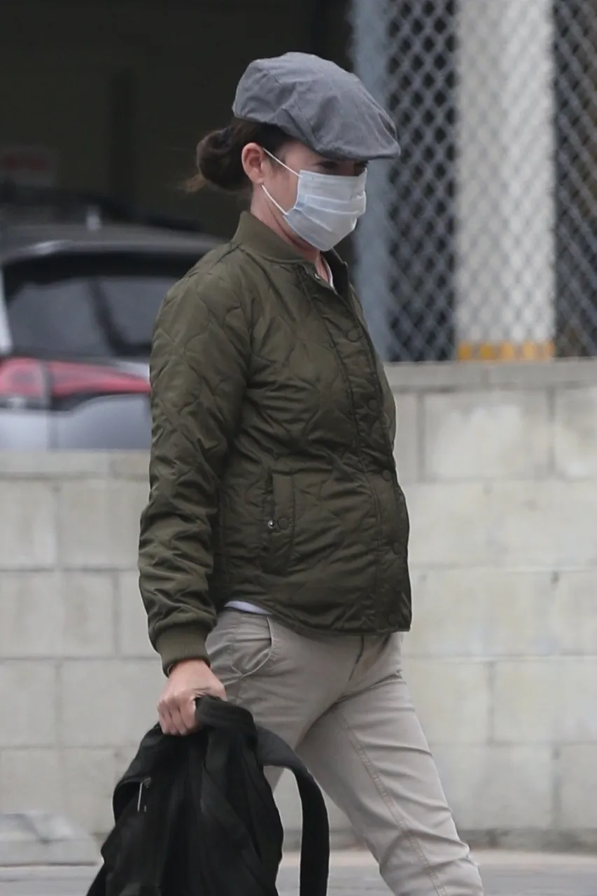 *EXCLUSIVE* Lara Flynn Boyle keeps it safe wearing a mask
