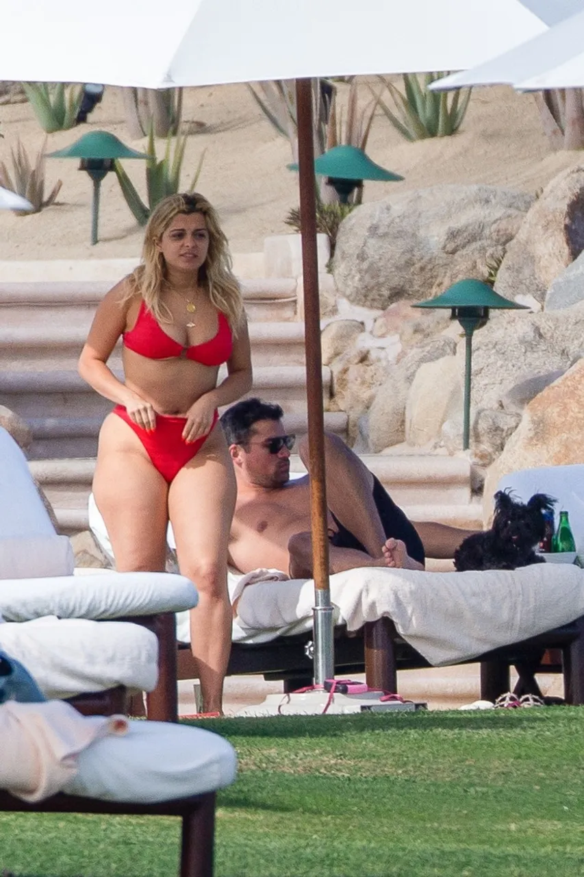 *PREMIUM-EXCLUSIVE* Bebe Rexha shows off her curves in a red bikini while soaking up the sun in Cabo