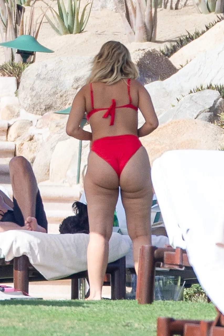 *PREMIUM-EXCLUSIVE* Bebe Rexha shows off her curves in a red bikini while soaking up the sun in Cabo