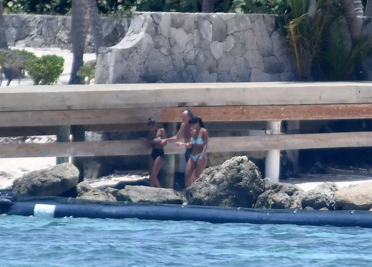 EXCLUSIVE: Julio Iglesias and two bikini-clad companions on the beach in front of his magnificent home in Punta Cana in the Dominican Republic