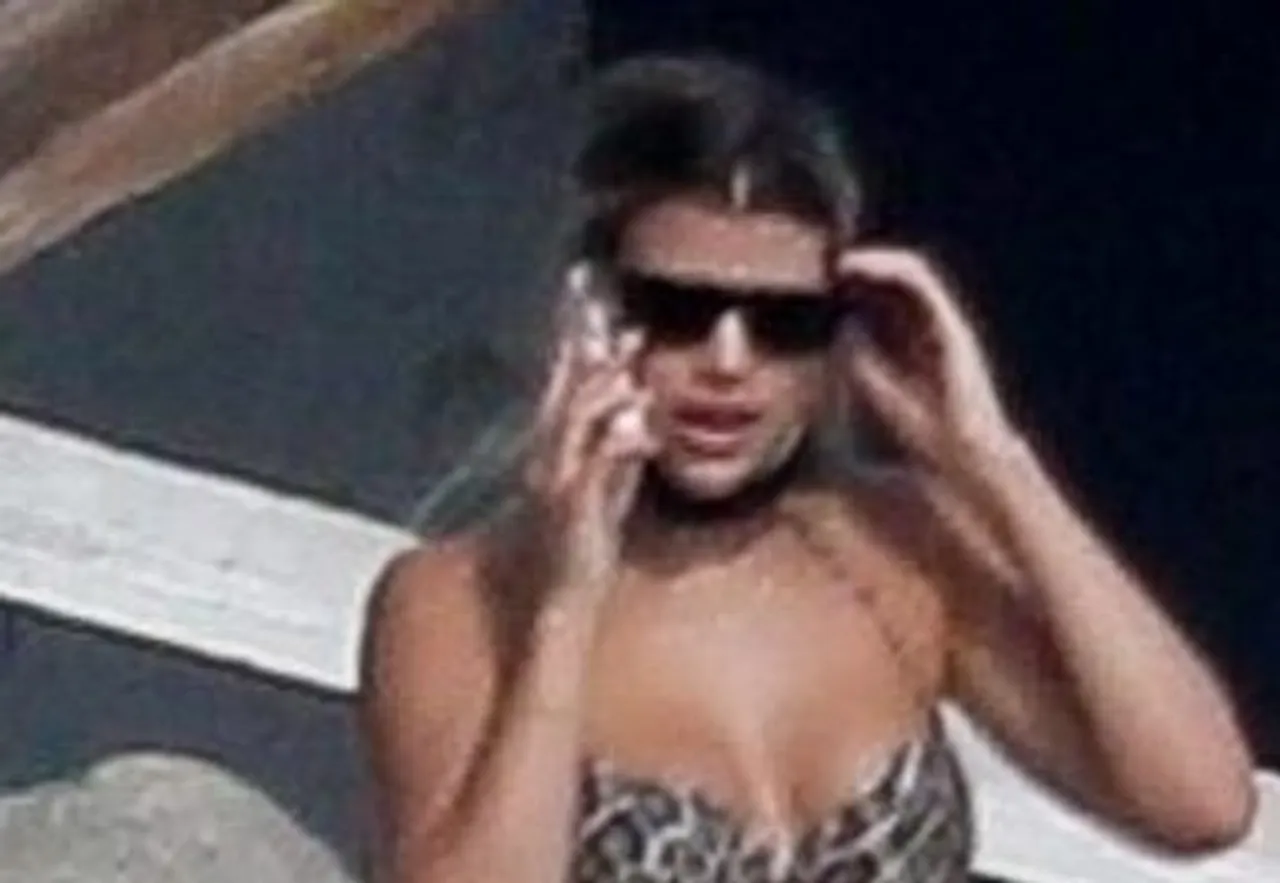 *EXCLUSIVE* Sofia Richie wears a leopard print bikini tanning with Scott Disick in Malibu